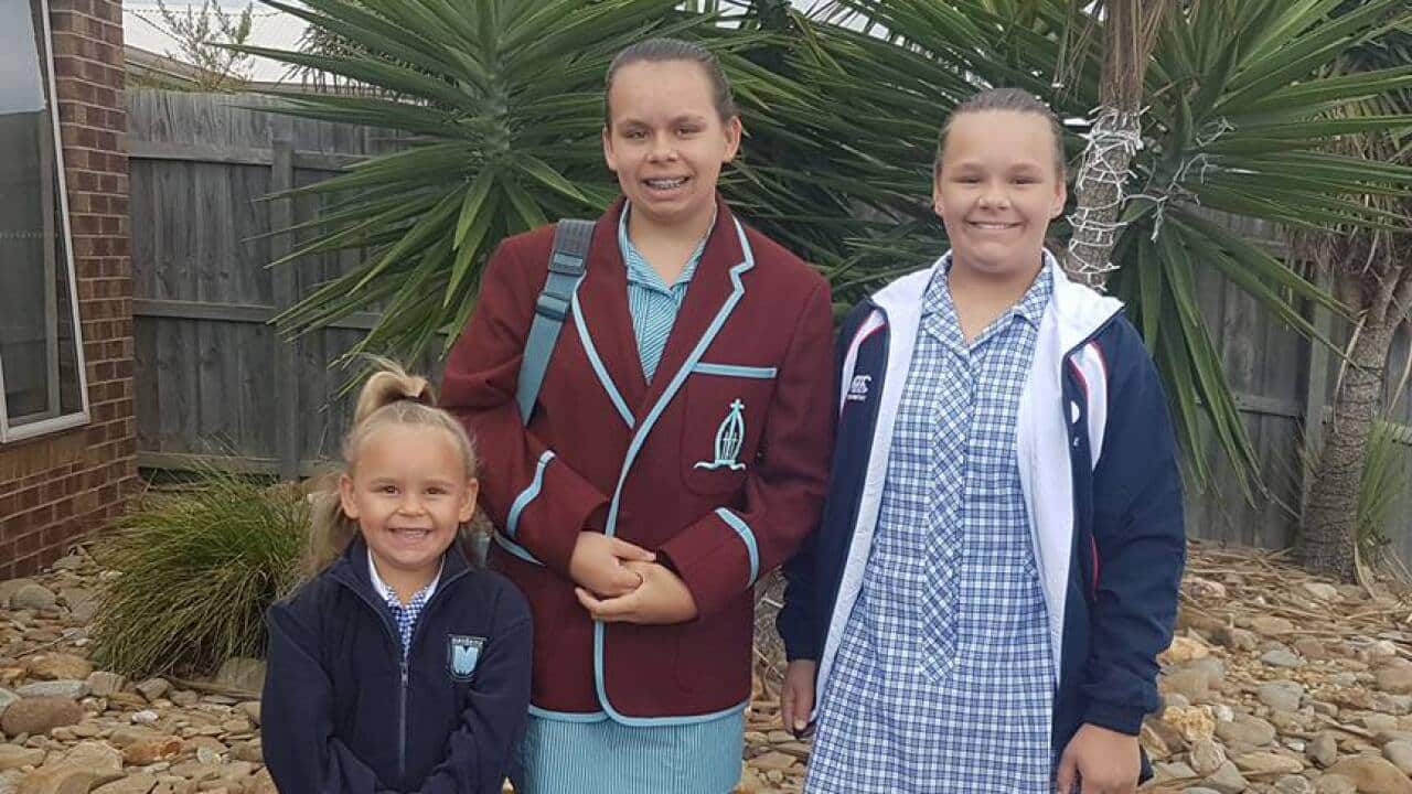 Zoe Walters and her family smile