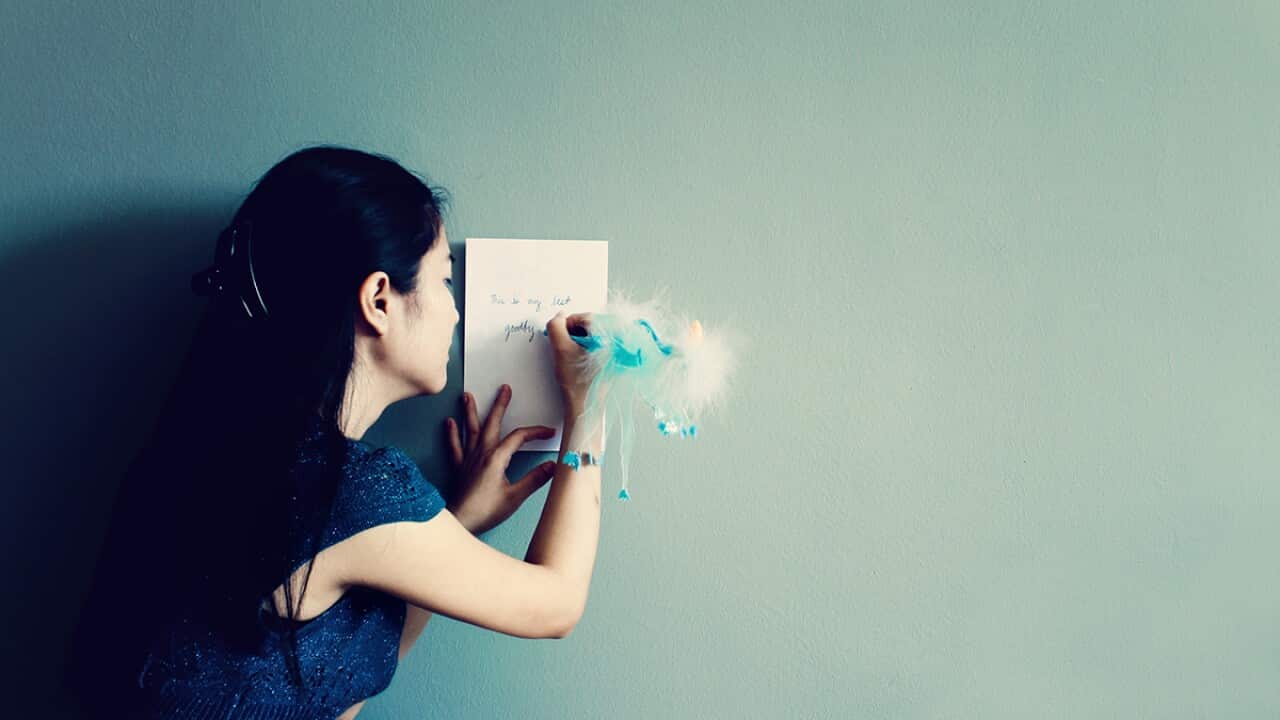 Young woman writting letter