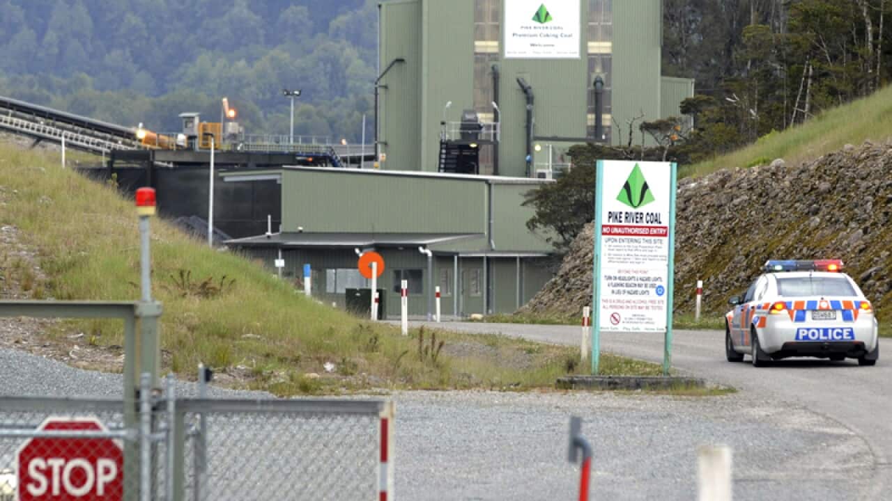 A police car enters the Pike River Coal Mine