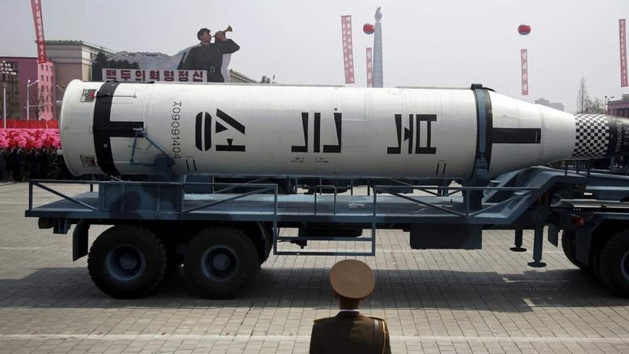 A submarine missile is paraded across the Kim Il Sung Square