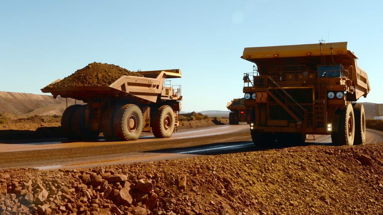 Haulage trucks at the Rio Tinto West Angelas iron ore mine in the Pilbara region of West Australia Wednesday, July 9, 2014. (AAP Image/Alan Porritt) NO ARCHIVING