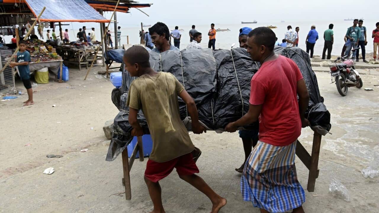 Local people remove their small shops near the sea beach at Patenga, Chottagong, Bangladesh