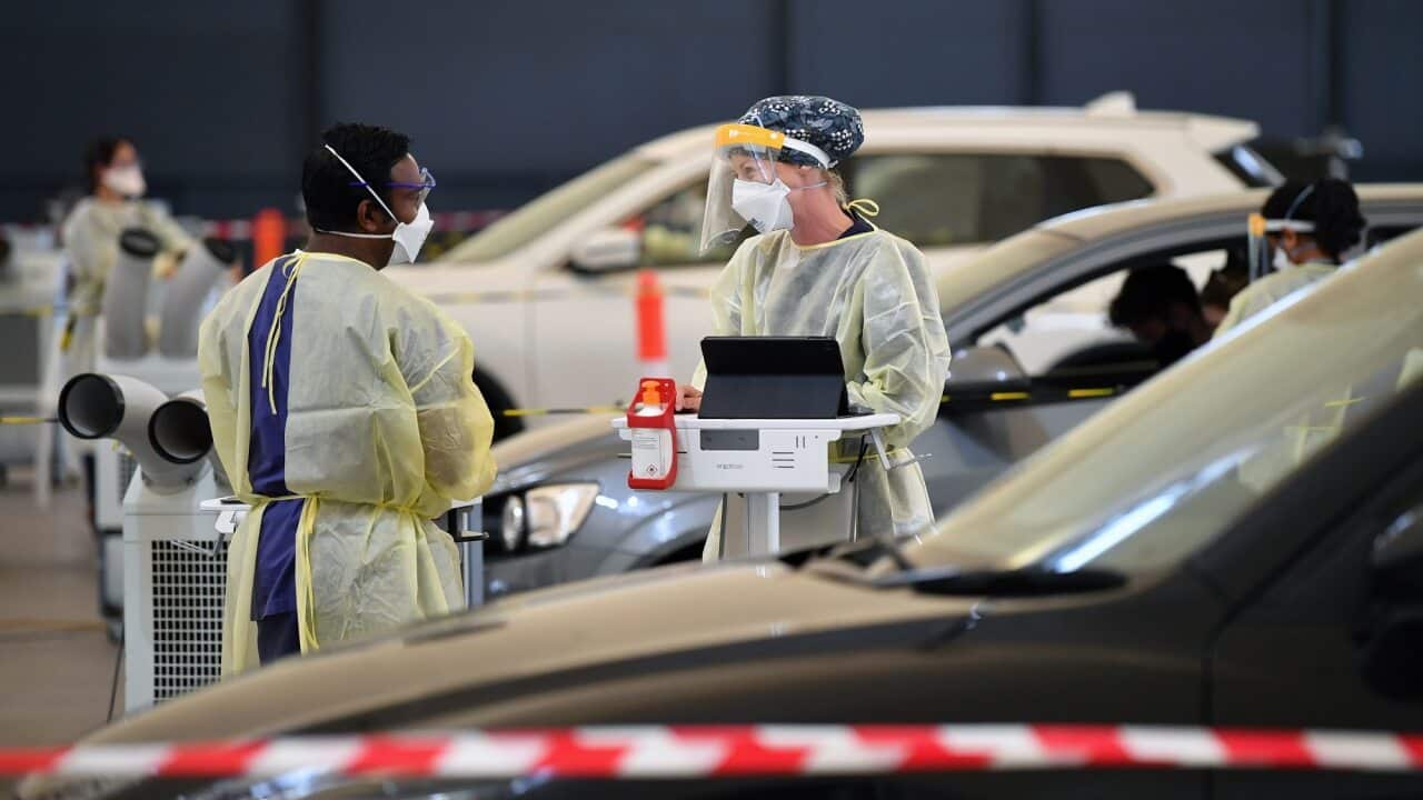 Members of the public are tested at a pop-up COVID-19 clinic in Melbourne's north.