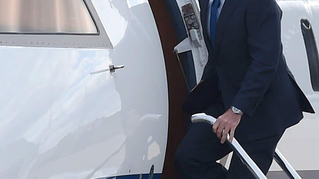 Former Australian Prime Minister Tony Abbott boards a government VIP air plane at Fairbairn Airport in Canberra, Friday, Sept. 18, 2015.