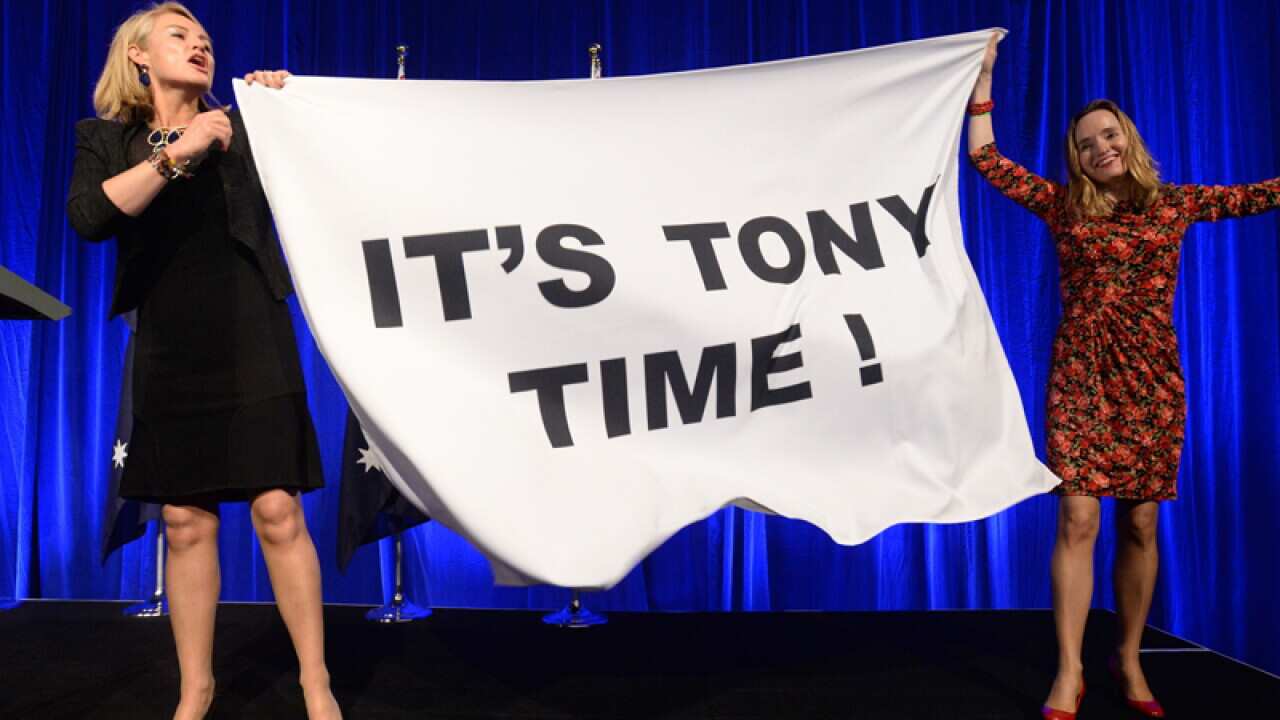 Supporters applaud a Tony Abbott victory on election night in Sydney