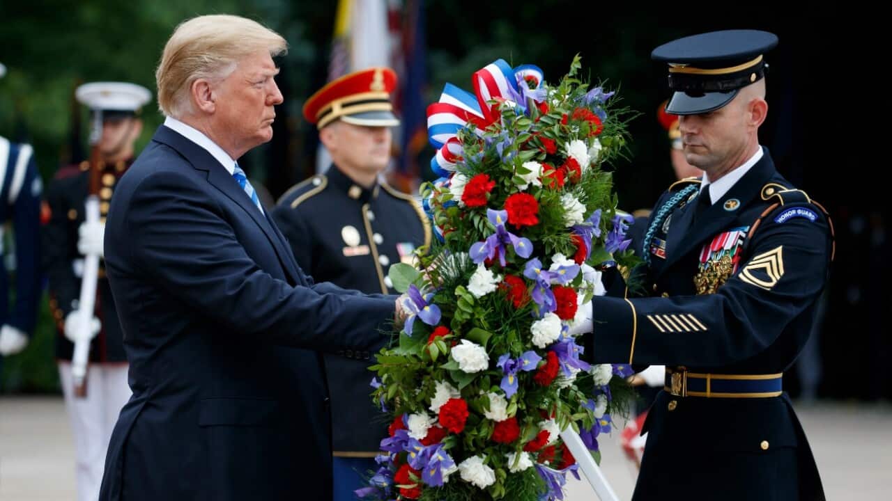 President Donald Trump lays a wreath during a Memorial Day ceremony at Arlington National Cemetery, Monday, May 28, 2018, in Arlington, Va.