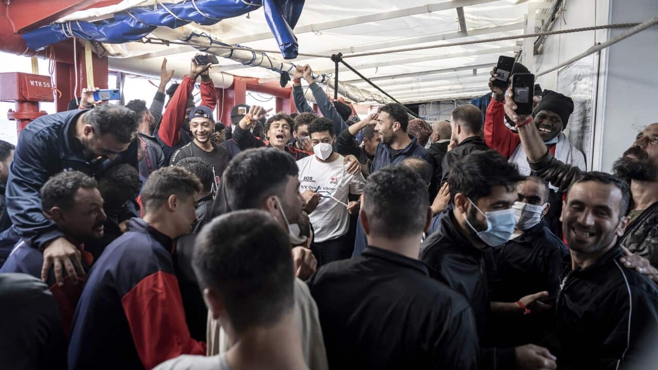 Migrants aboard the Ocean Viking react, as they learn they are heading to Toulon, France