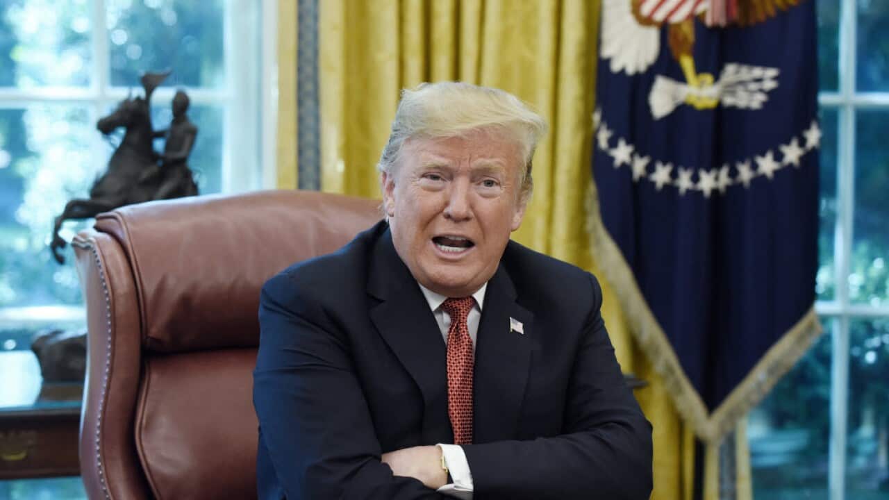 US President Donald Trump speaks during a meeting