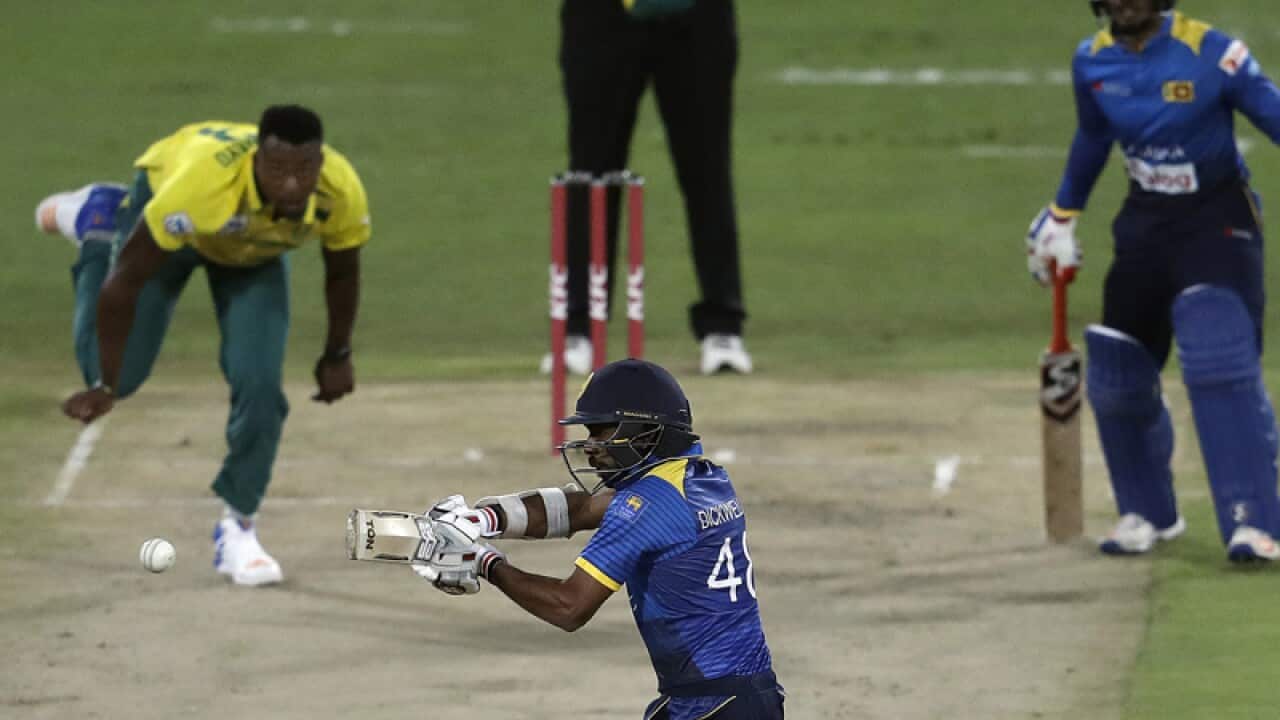 Sri Lanka's batsman Niroshan Dickwella (C) plays a shot