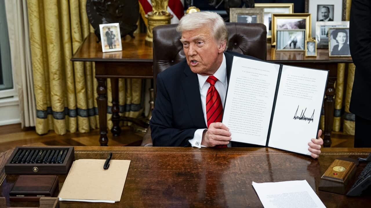 US President Trump signs executive order in Oval Office