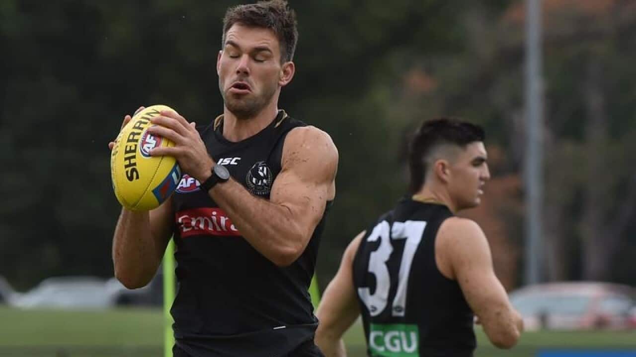 Levi Greenwood (left) of the Collingwood Magpies.