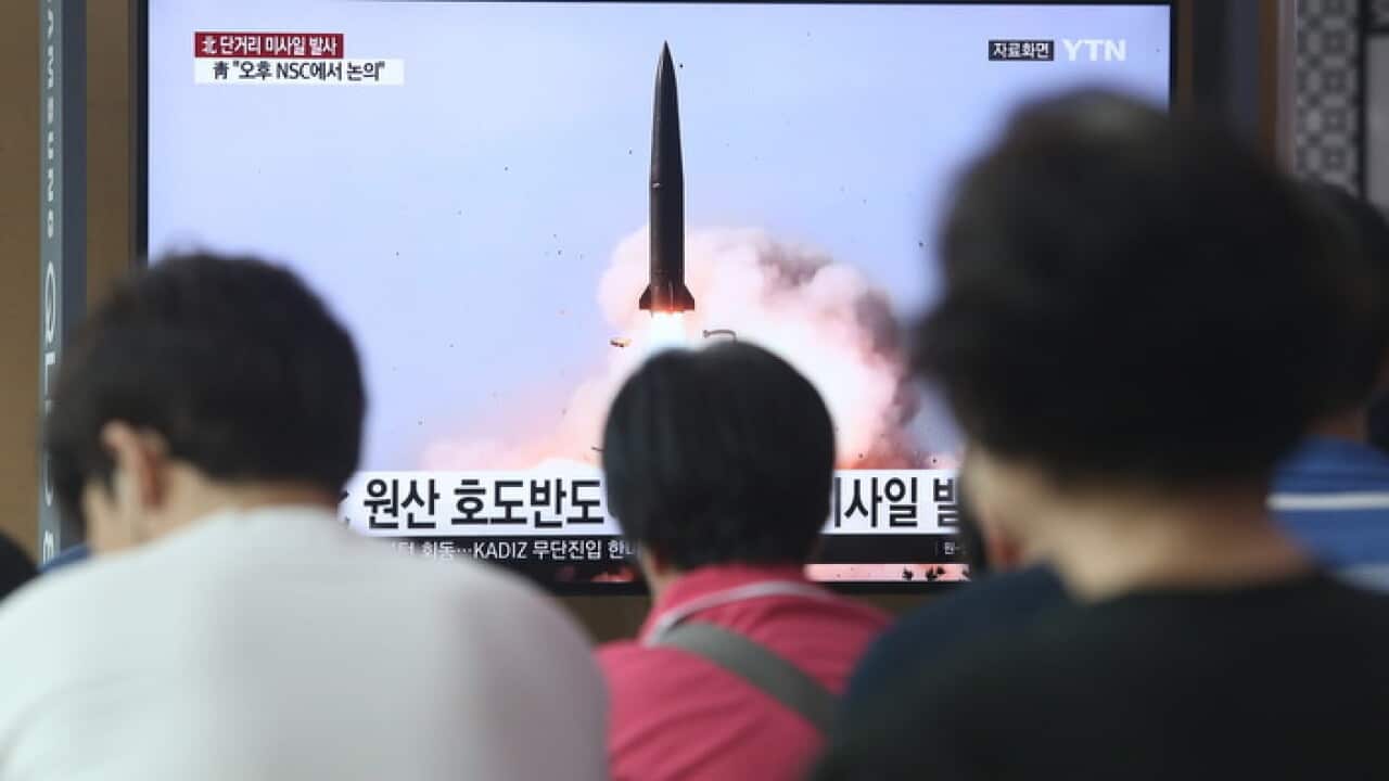epa07738873 South Korean people watch breaking news of North Korea's missile launch, at Seoul Station in Seoul, South Korea, 25 July 2019. According to South Korea's military, North Korea on 25 July fired two short-range missiles toward the East Sea. EPA