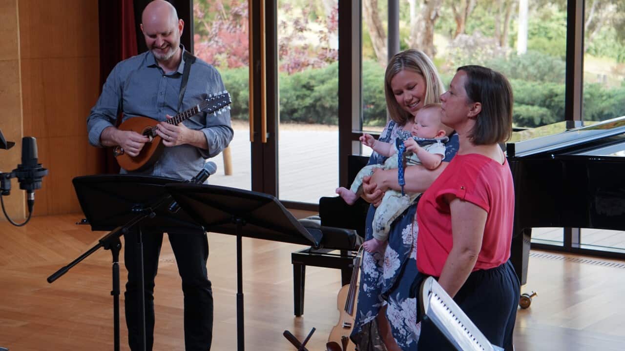 Samantha Jackson and musicians sing a lullaby to baby Benjamin to help him connect to his Wiradjuri roots.