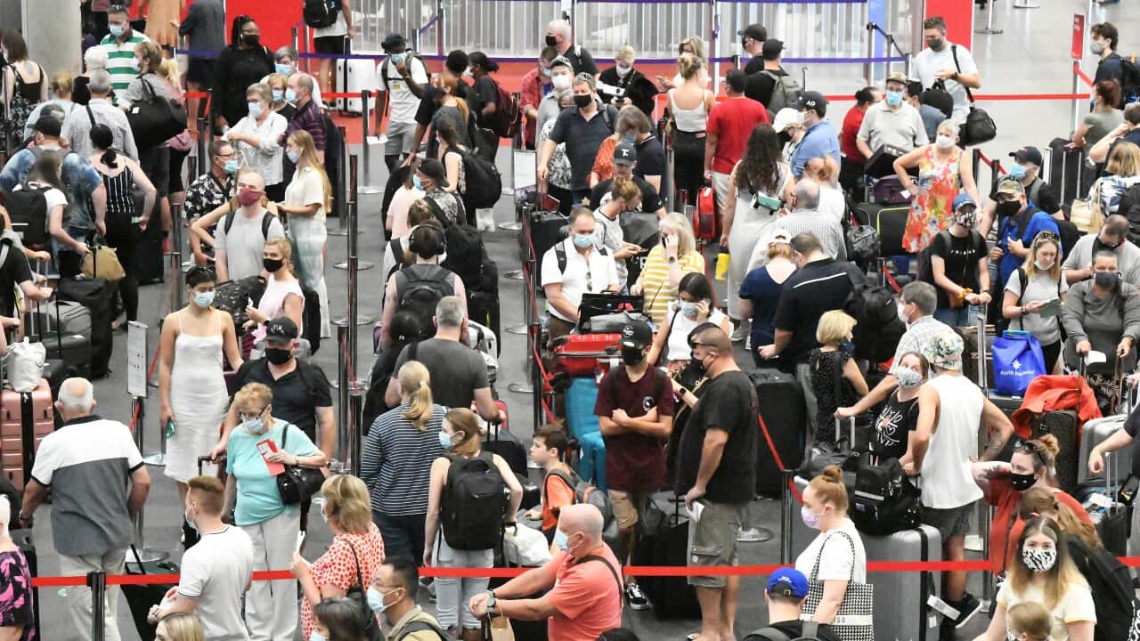 Passengers check in for flights out of Brisbane, Monday, March 29, 2021. Greater Brisbane will enter a snap three-day lockdown as its coronavirus outbreak continues to grow.(AAP Image/Dave Hunt) NO ARCHIVING, EDITORIAL USE ONLY