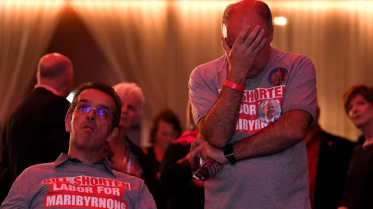 Labor supporters watch the tally count at the Federal Labor Reception in Melbourne.
