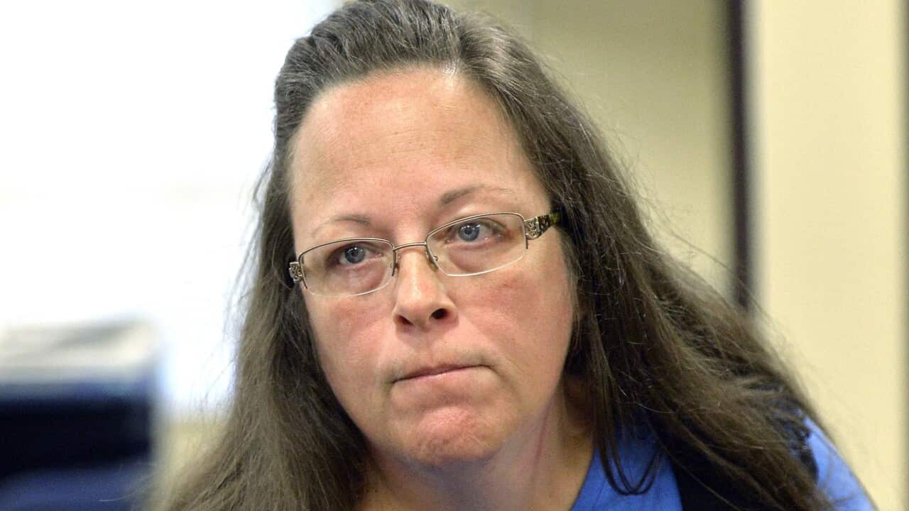 Kim Davis listens to a customer at the Rowan County Courthouse.