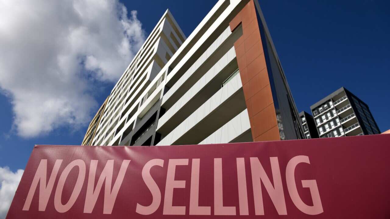 For Sale signs are seen outside a unit block in Sydney.