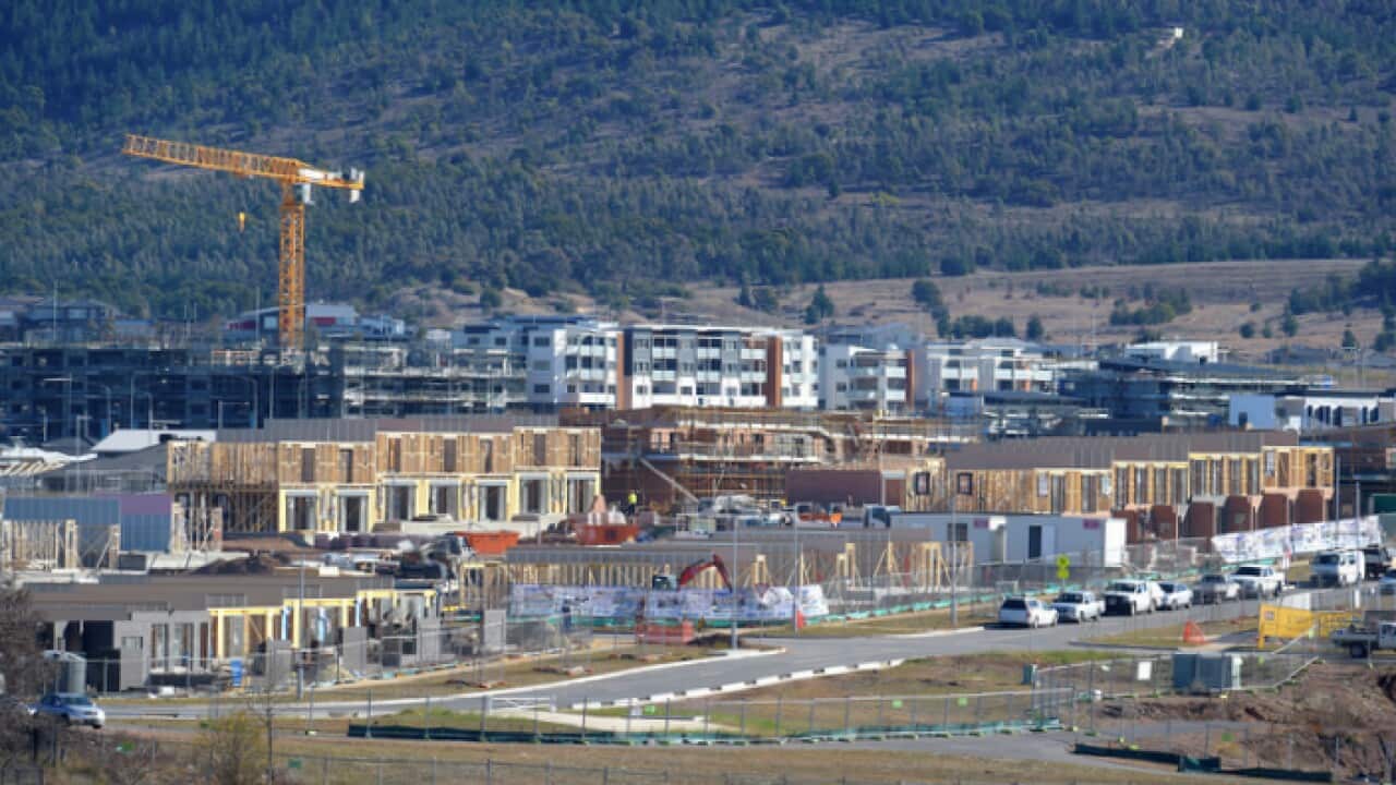 Construction of apartments and houses in Wright, a new suburb in Canberra (AAP)