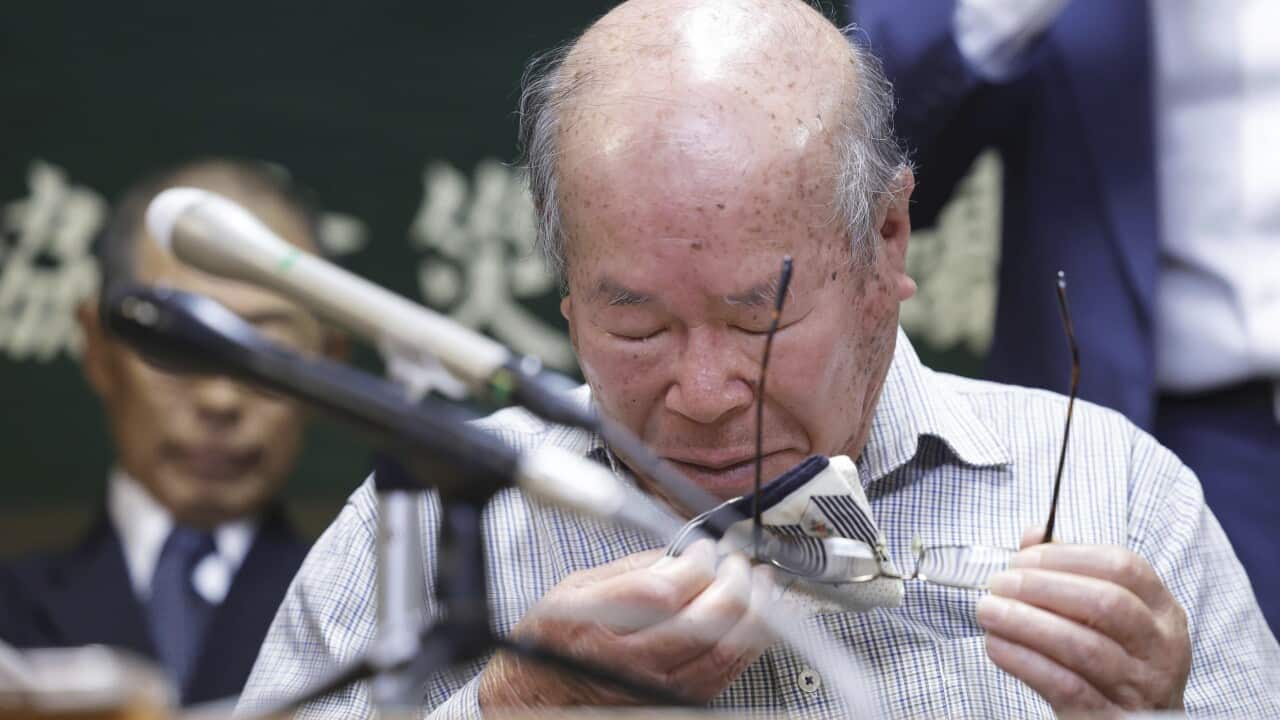 The chairman of Nagasaki Atomic bomb Survivors Council cries during a press conference after Nihon Hidankyo wins Nobel Peace Prize.