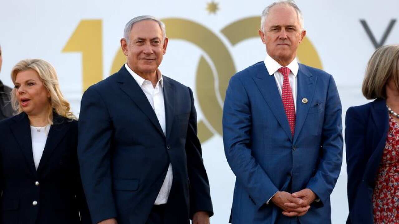 Australian Prime Minister Malcolm Turnbull R) and Israeli Prime Minister Benjamin Netanyahu (L), look on as Australians and New Zealanders in World War I uniforms reenact the Battle of Beersheba