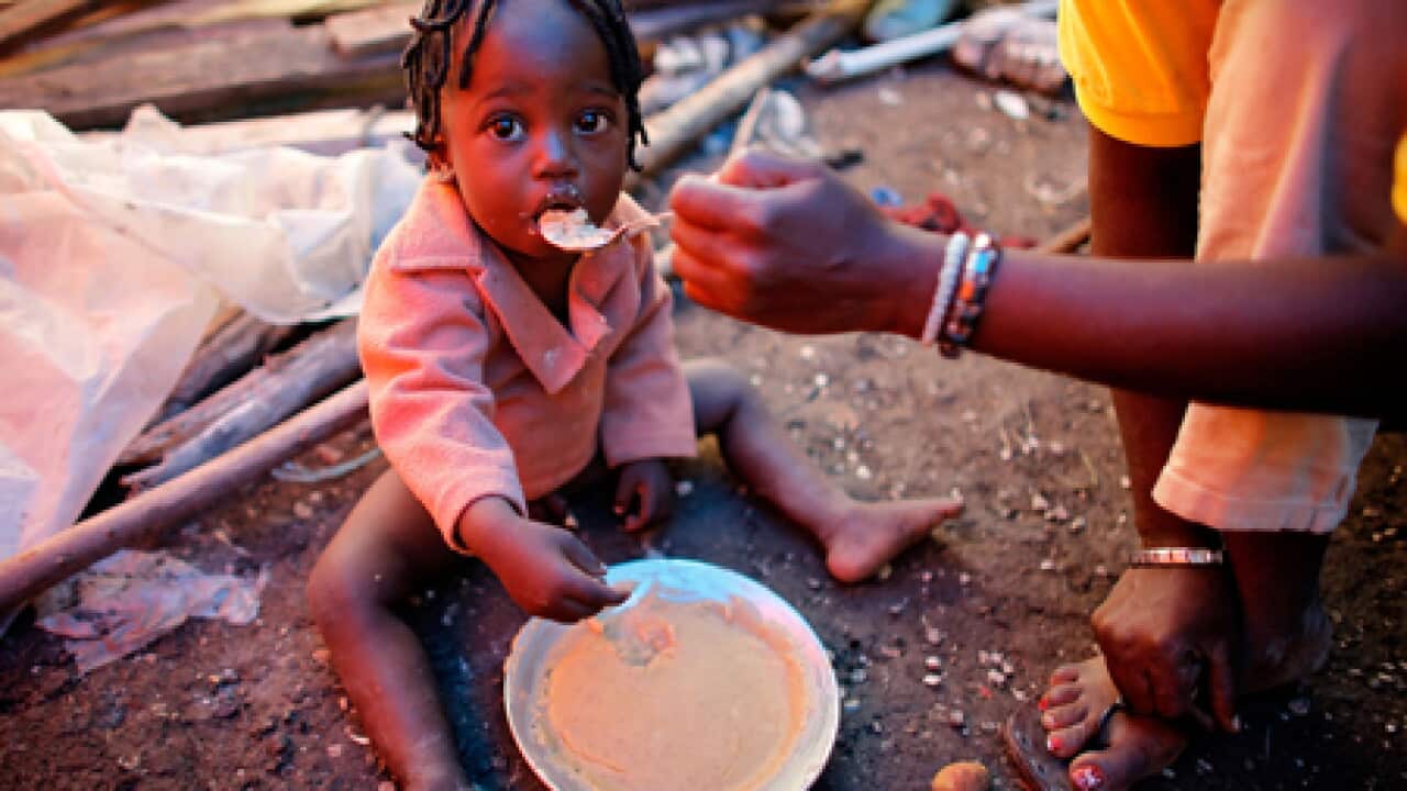 haiti_child_feeding_100922_B_getty_2097051948