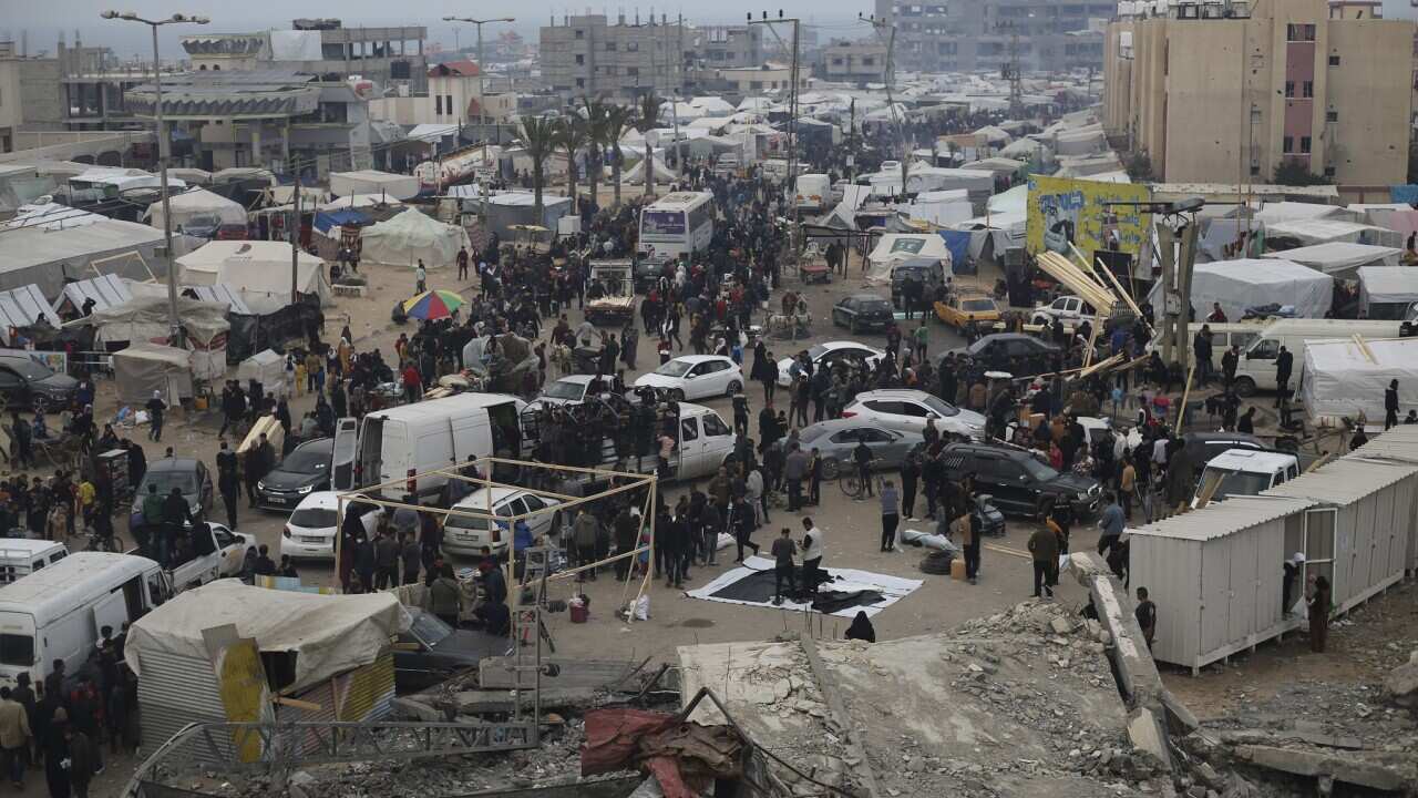 Displaced Palestinians arrive at a makeshift tent camp in Rafah, Gaza Strip (AAP)