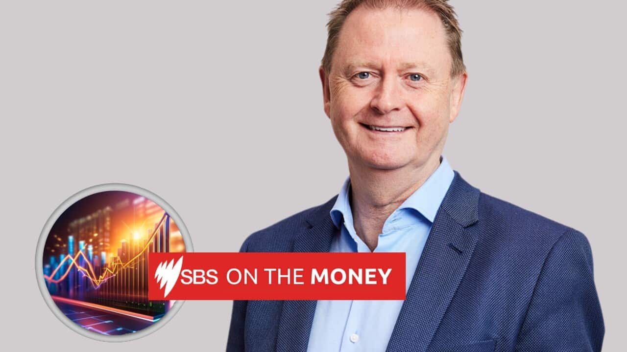 Man in a blue suit smiling