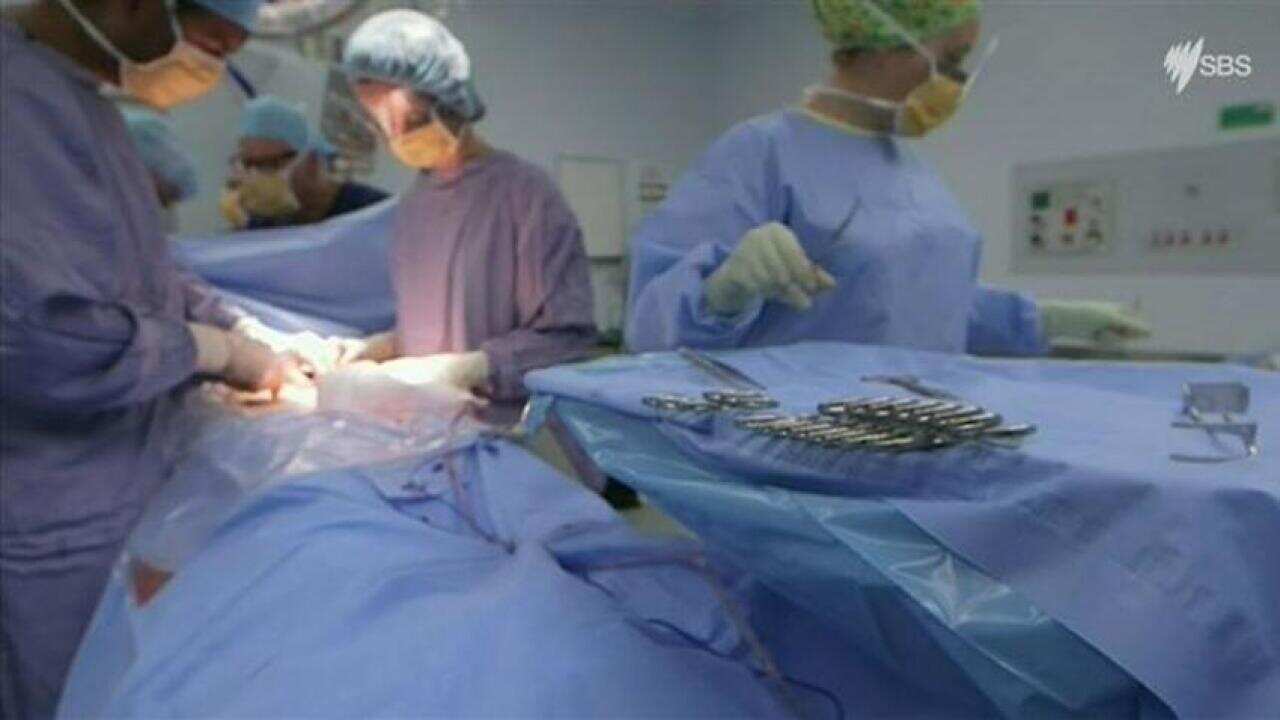 Doctors performing a medical procedure