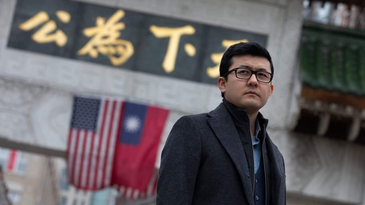 Kamaltrk Yalqun stands for a photograph in Chinatown, Friday, 28 January, 2022, in Boston, USA.