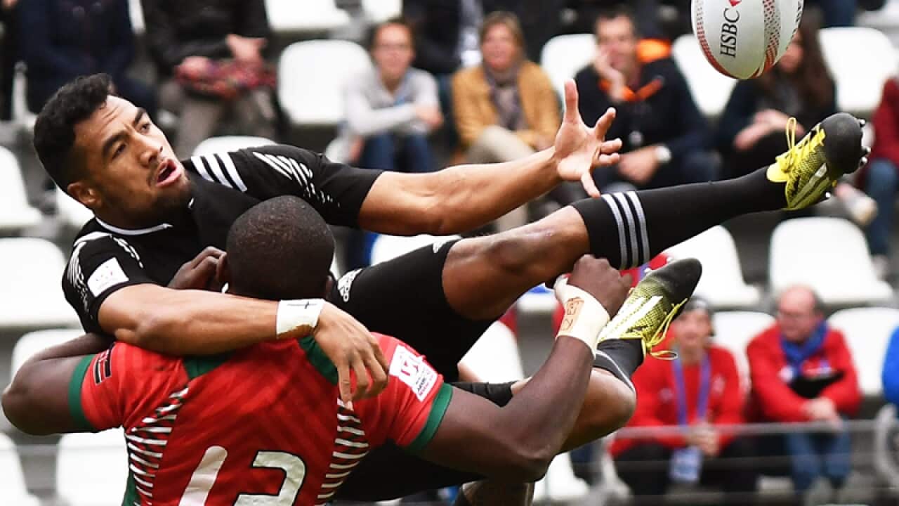 New Zealand's Sione Molia (right) is tackled by Kenya's Willy Ambaka