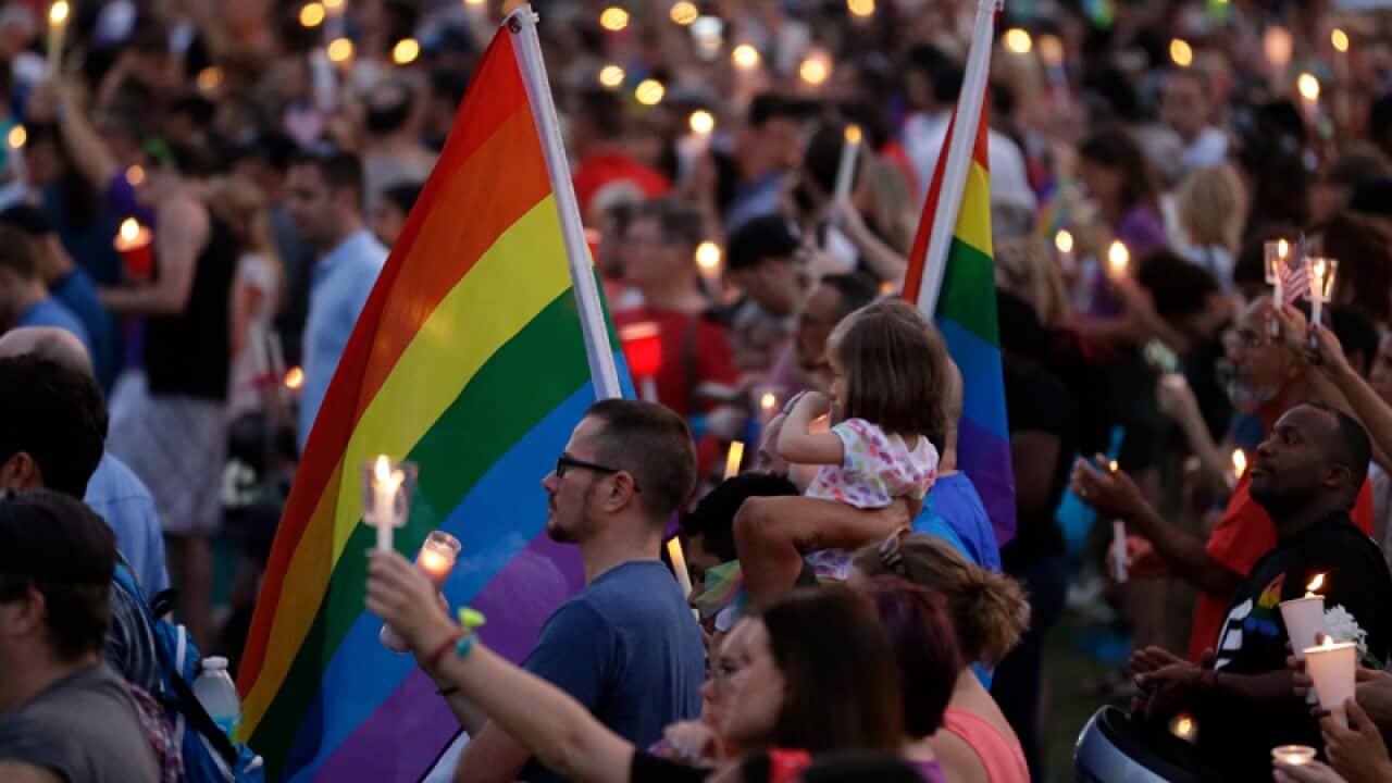 Supporters of the victims of the Orlando shooting attend a vigil