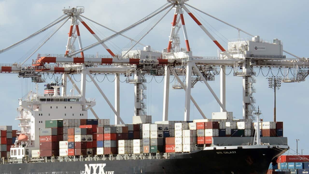 A container ship is docked at the Port of Brisbane