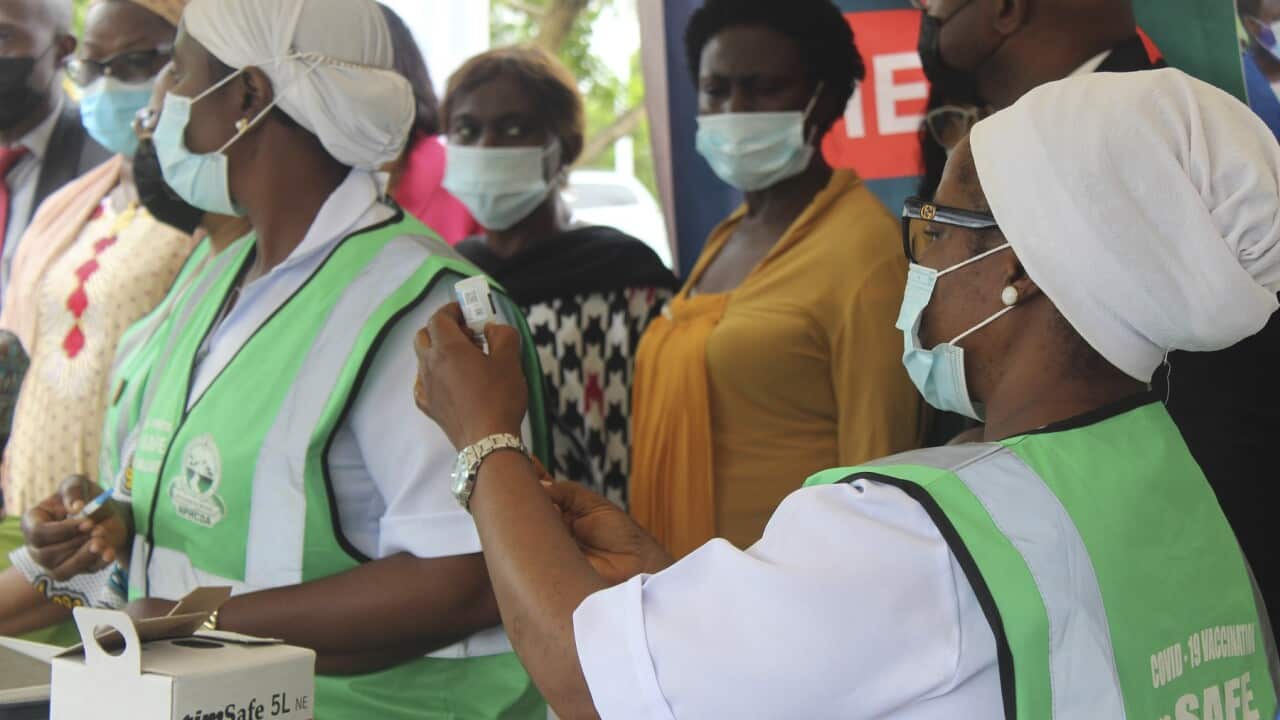 A nurse prepares a coronavirus vaccination in Abuja, Nigeria