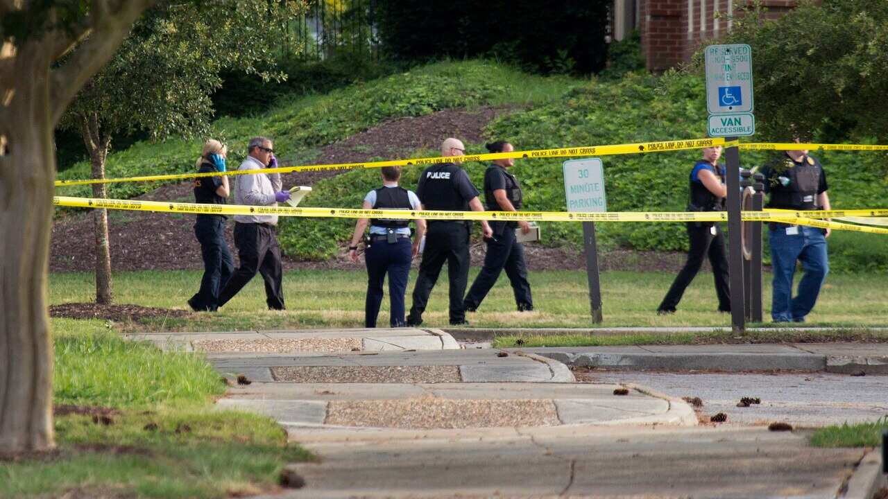 Police at the scene of the mass shooting at the Virginia Beach city public works building.