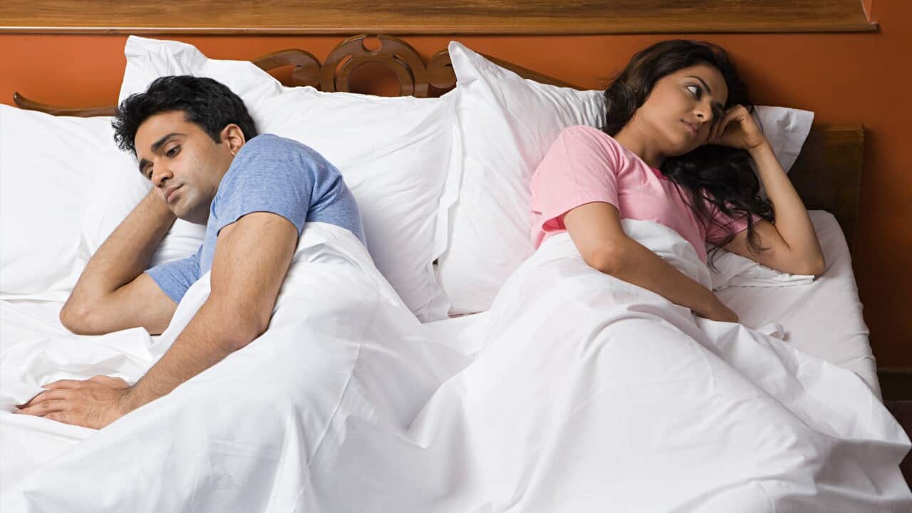 A couple not speaking to each other