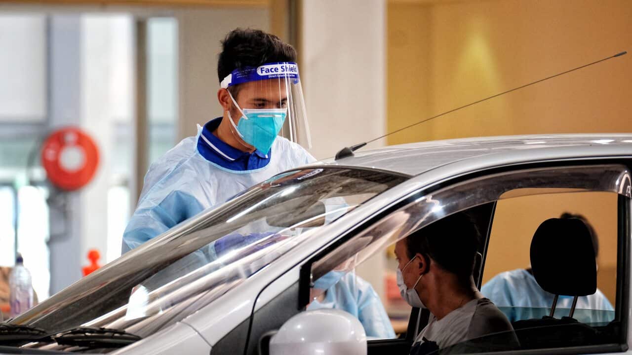 Medical staff work at a COVID-19 pop-up testing centre in South Melbourne