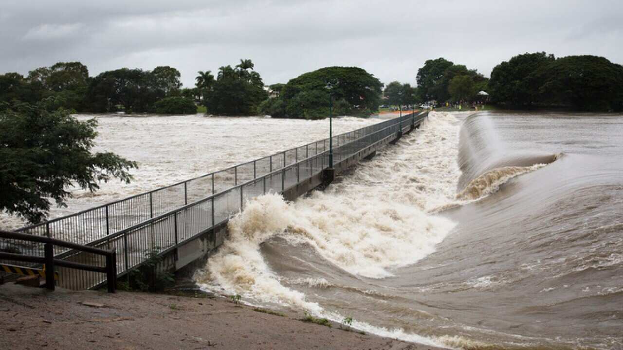 Floodwaters are seen at Aplins Weir in Townsville