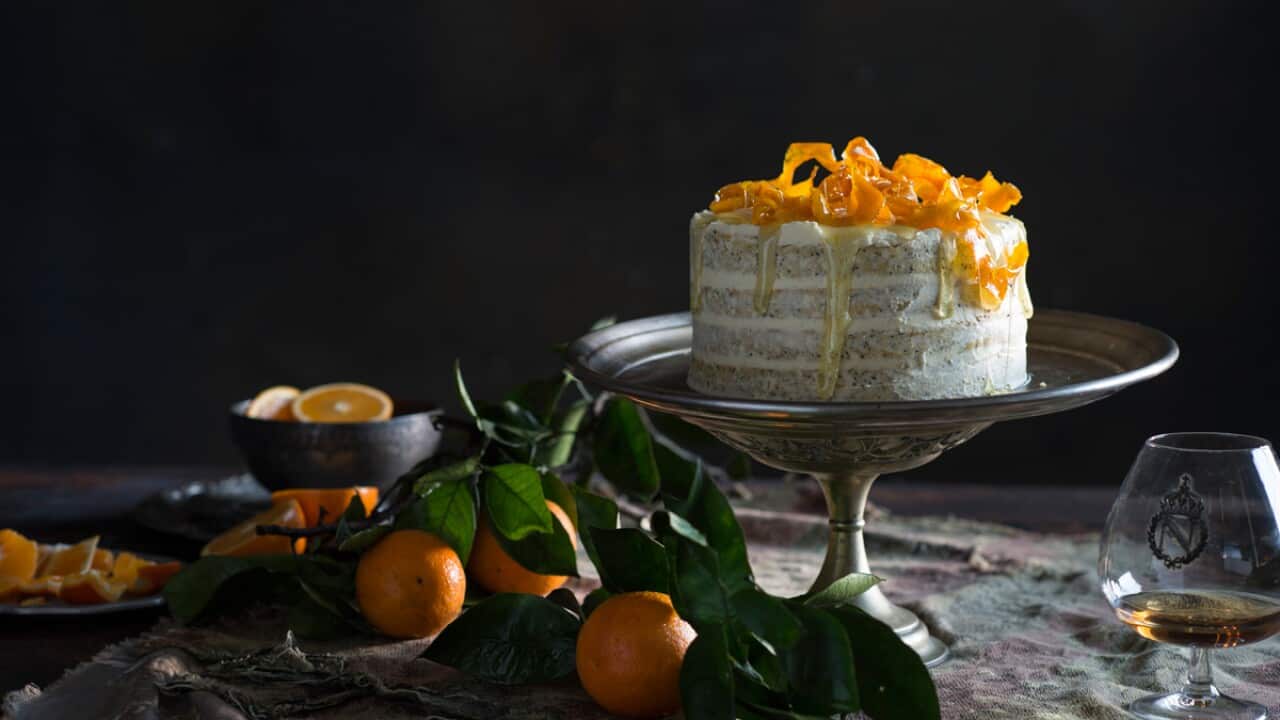 Naked orange poppy seed cake with orange blossom frosting