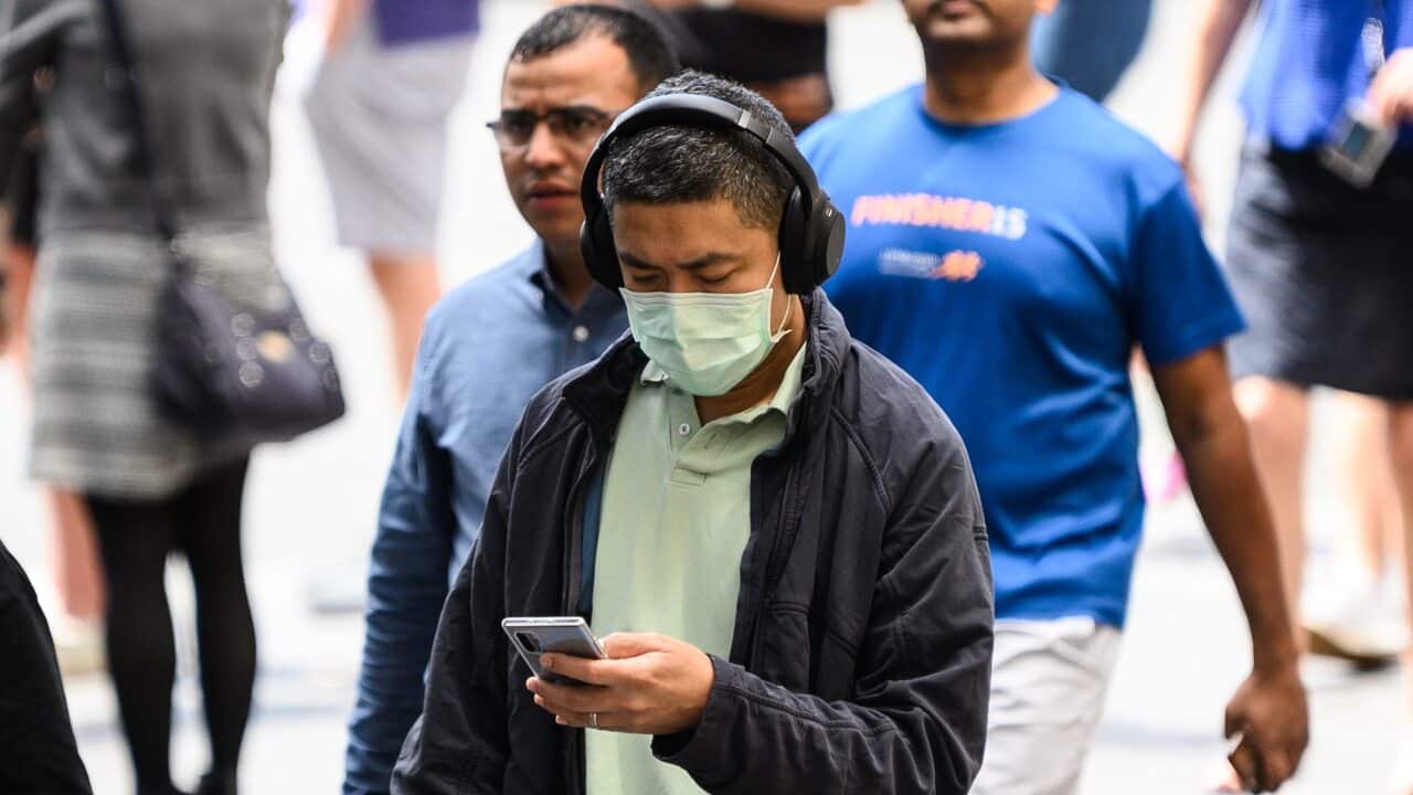 A man wearing a protective face mask seen in Sydney, Monday, March 2, 2020. (AAP Image/James Gourley) NO ARCHIVING