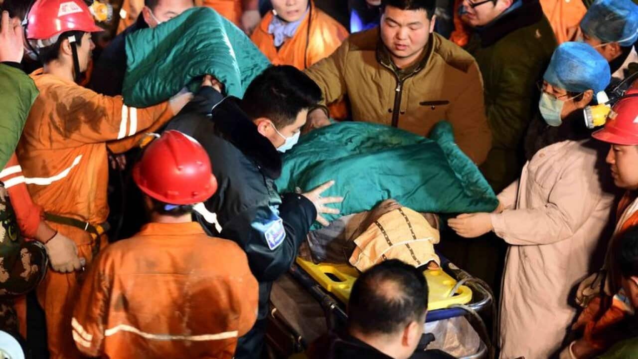 A trapped miner is rescued from a collapsed gypsum mine in Pingyi County, east China's Shandong Province.