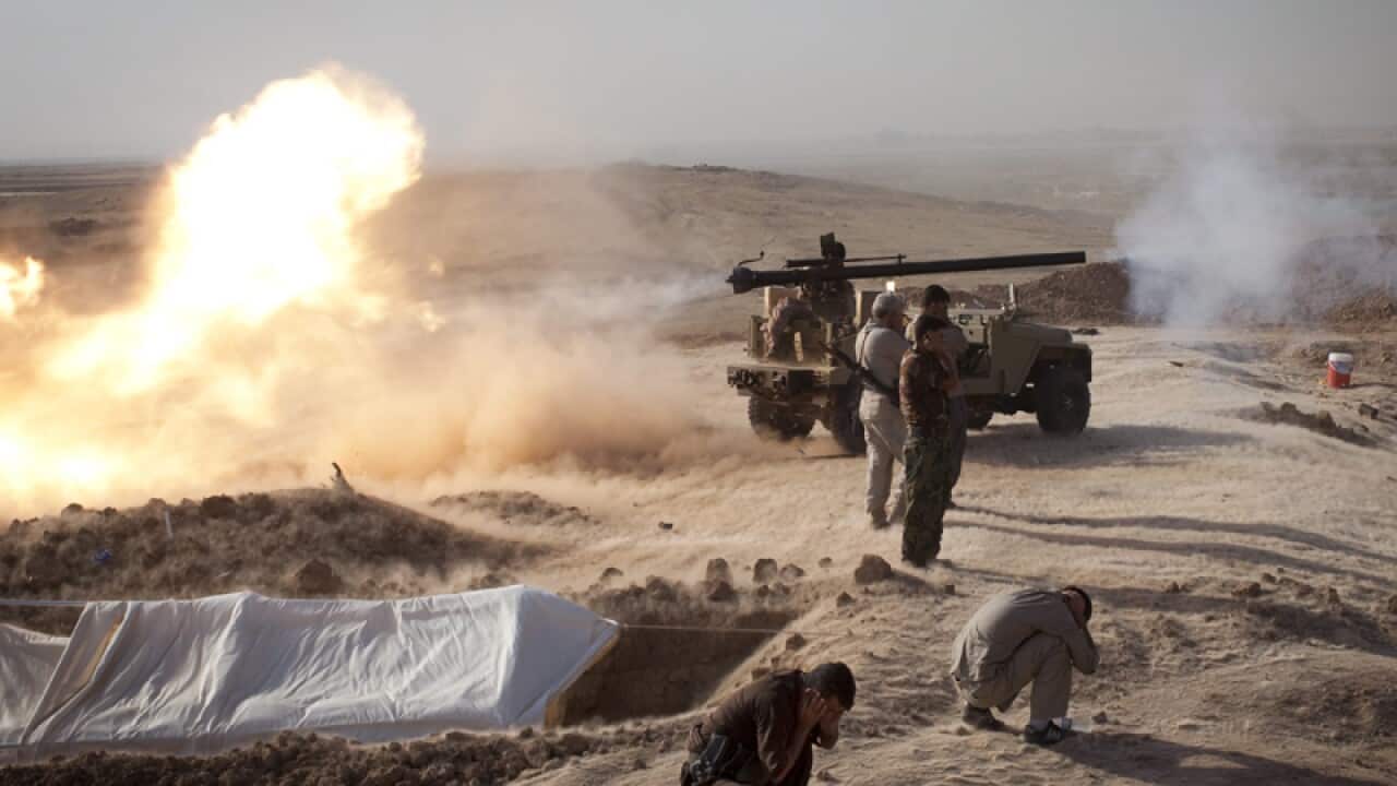 Peshmerga fighters fire cannon towards Islamic State positions