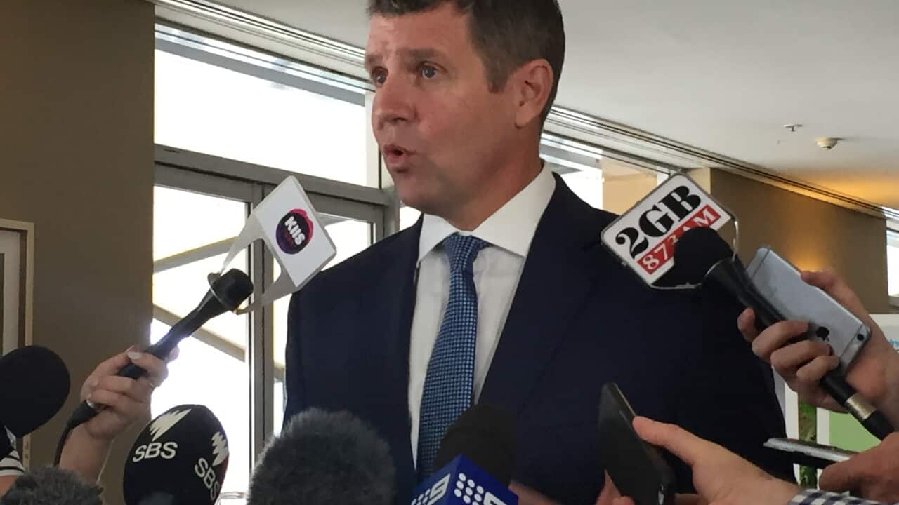 NSW Premier Mike Baird talks to the reporter