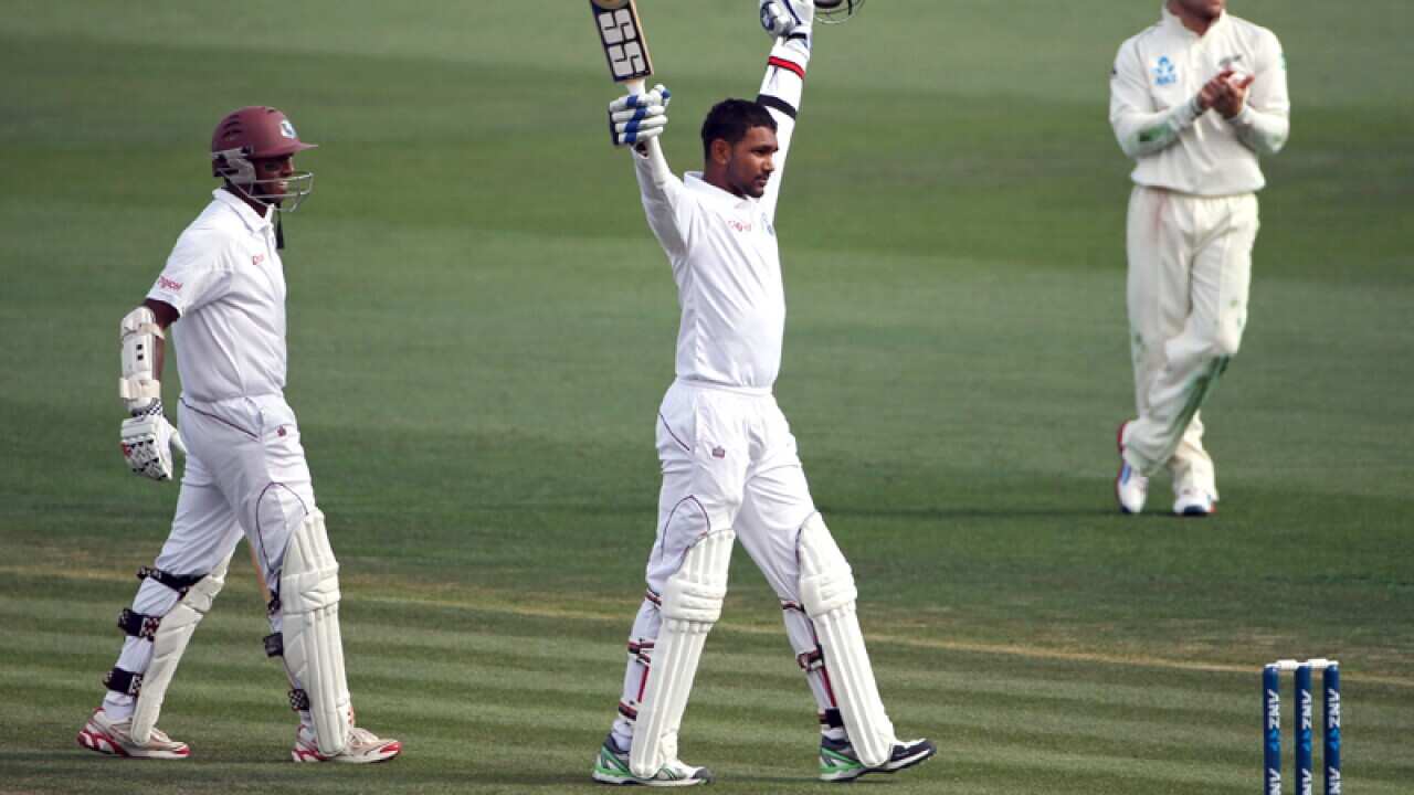 Denesh Ramdin of the West Indies (C) celebrates scoring a century