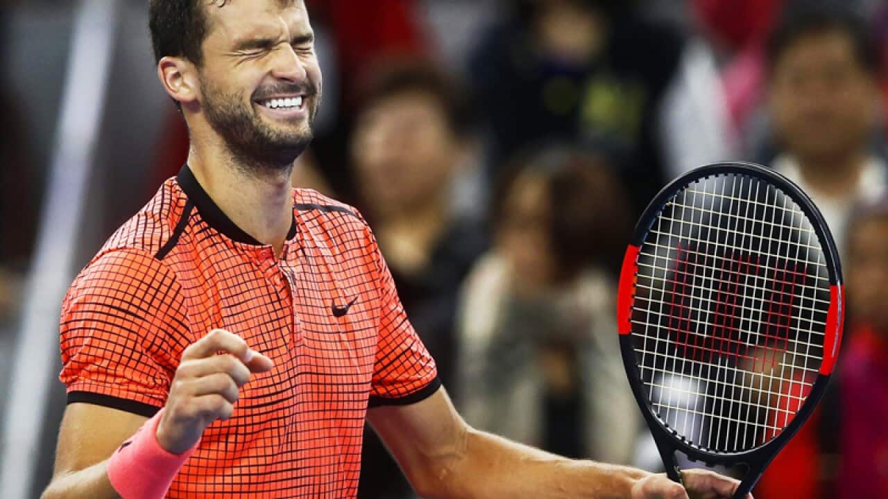 Grigor Dimitrov of Bulgaria reacts after defeating Rafael Nadal