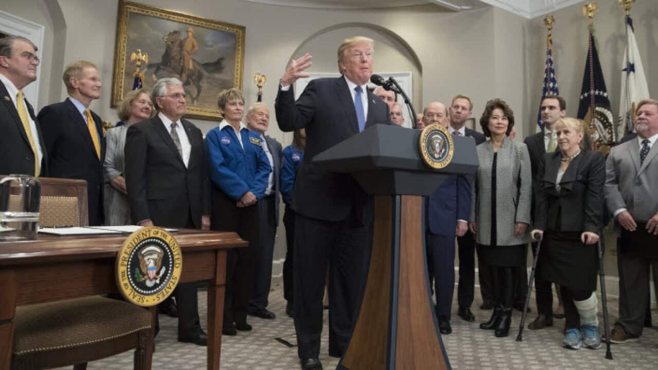 US President Donald Trump signs Space Policy Directive 1, an executive order to send US astronauts back to the moon