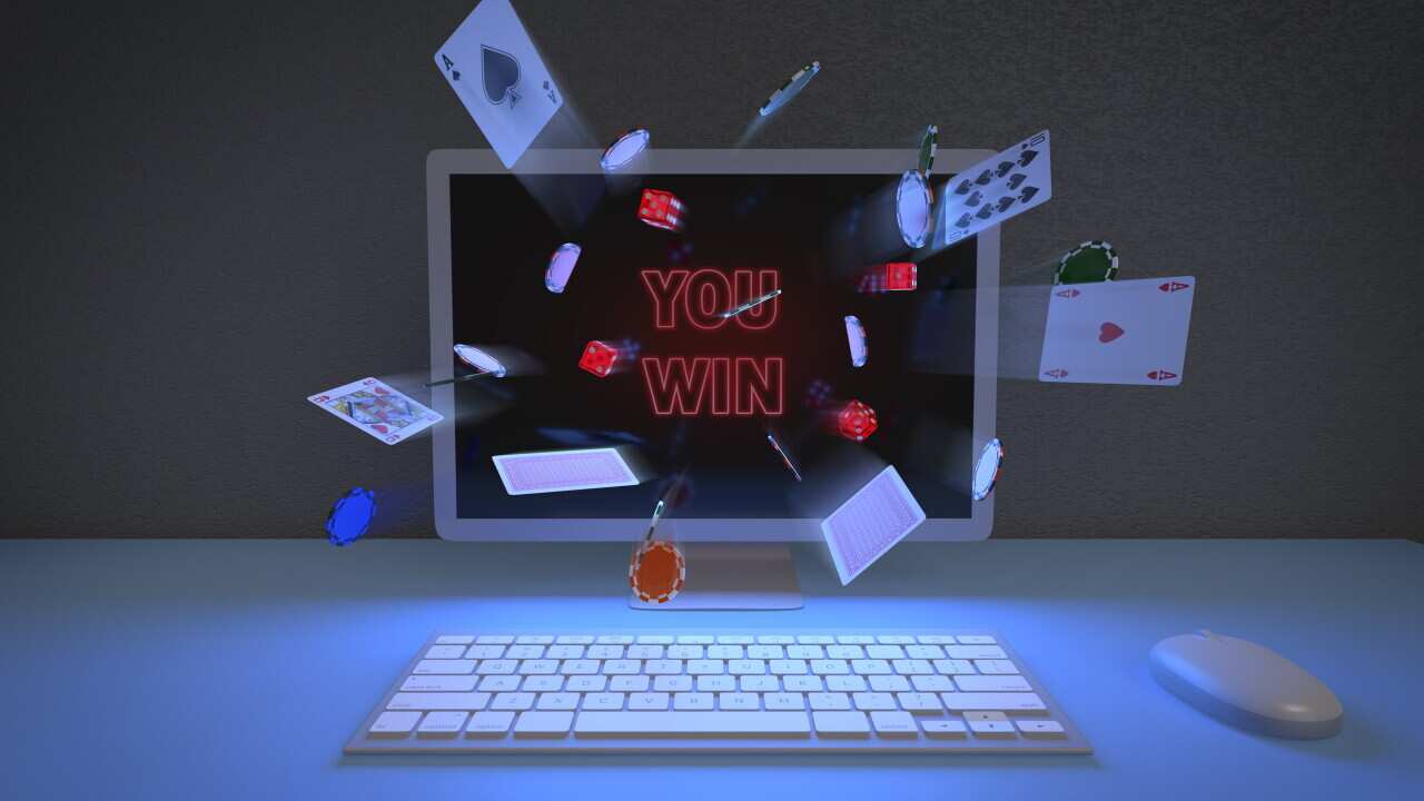 Front view of chips, cards and dice coming out of a computer monitor. Online games concept. 3d illustration.