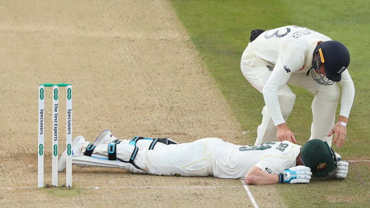 Jos Buttler of England rushes to the aid of Steve Smith of Australia during the 2nd Specsavers Ashes Test Match, at Lords Cricket Ground, London, England on August 17, 2019.(Photo by ESPA/Cal Sport Media/Sipa USA).