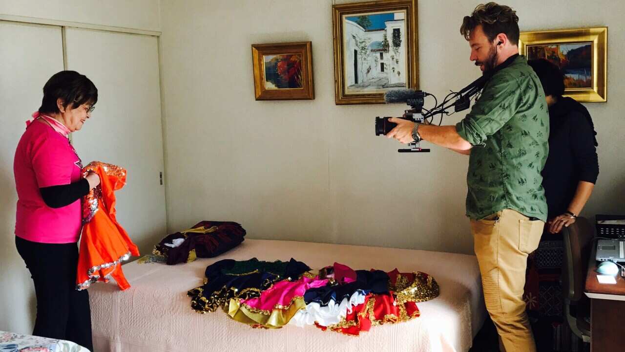 Dateline reporter Dean Cornish with 86-year-old cheerleader Fumie Takino.