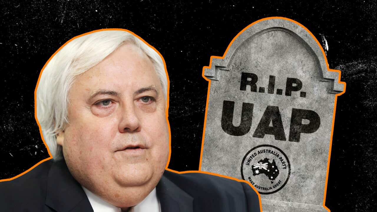 A man with white hair next to a fake tombstone that reads "R.I.P. UAP".