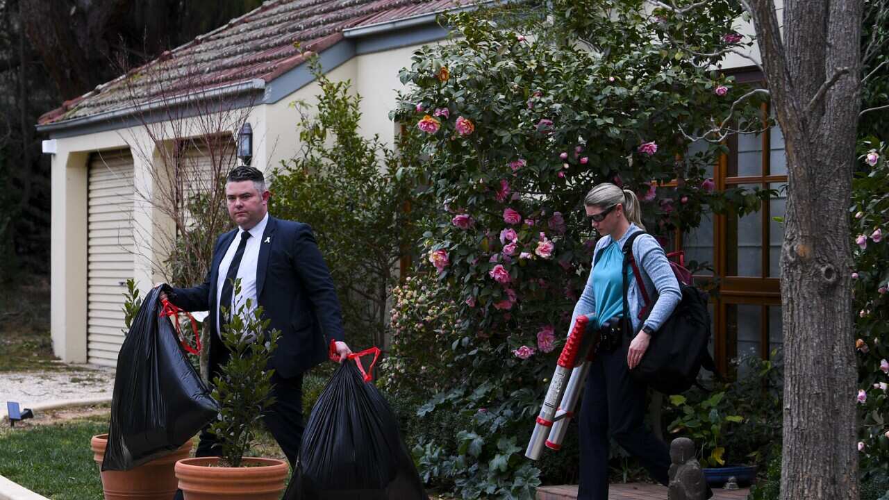 The AFP conduct a raid at a home in Canberra (AAP).jpg